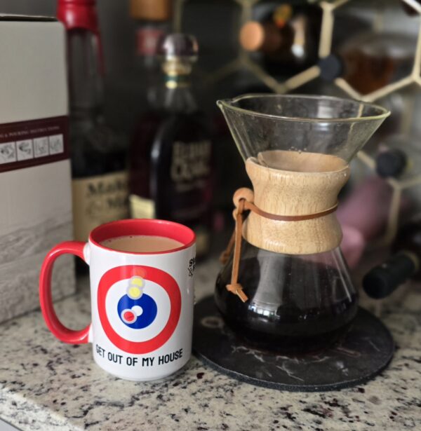 Get Out Of My House Mug from Stone And Broom next to a pour over coffee maker.