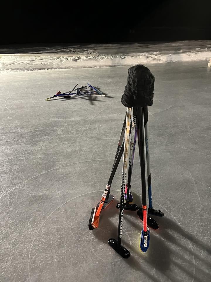 Modern Broomstacking with Curling Brooms "Stacked" on a frozen lake at an outdoor Spiel